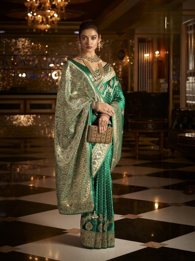 luxurious green saree adorned with golden embroidery